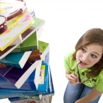 study strategy needed by girl with stack of books